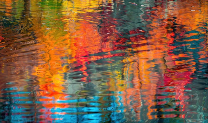 The vibrant colors of autumn reflected in the crystal-clear waters of the lake AI generated