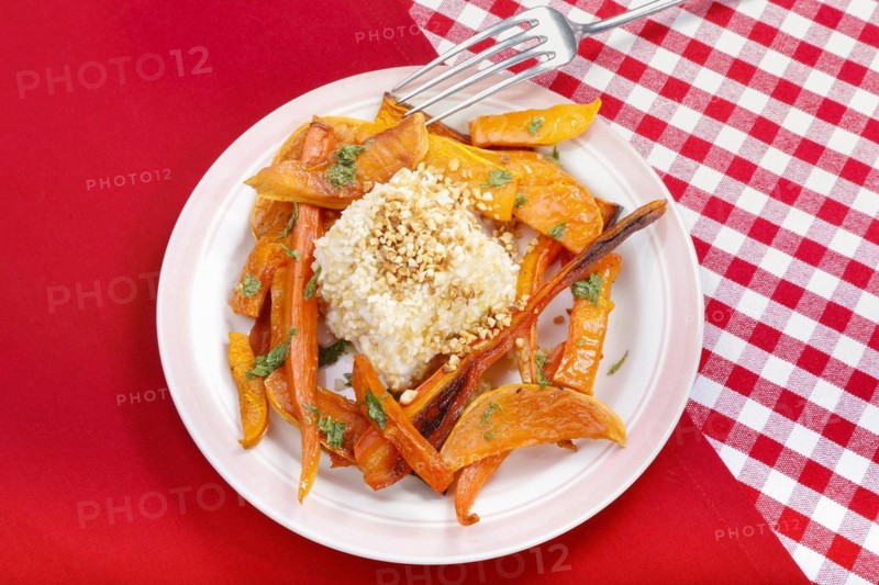 South German cuisine, butternut squash, butternut squash, baked squash with goat's cheese, cheese in a nut crust, nut coating, vegetables cut on a plate, fork, oven vegetables, pumpkin, fruit vegetables, fruit, carrots, celery, healthy cooking, vegetarian, autumn cuisine, pumpkin dishes, food, studio, Germany, Europe