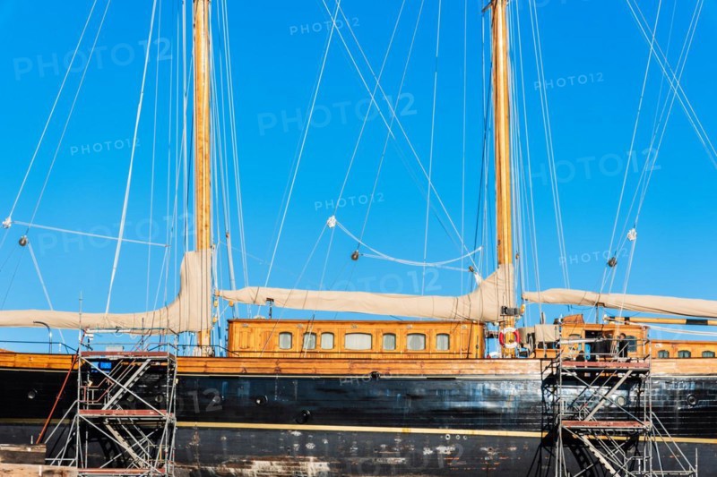 Old sailing ship in a shipyard in the old harbour of Barcelona, Spain, Europe