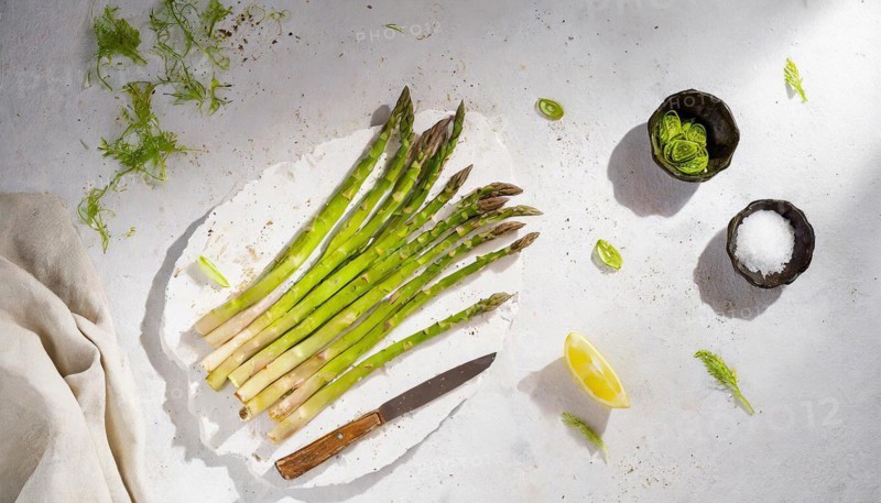 A bright, invigorating image of asparagus on a plate with lemon and cutlery, AI generated, AI generated
