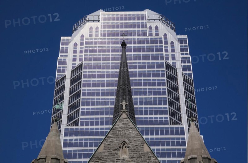 Old Christ Church Cathedral facade with spire and modern architectural steel and blue tinted glass windows KPMG office tower in summer, Montreal, Quebec, Canada, North America