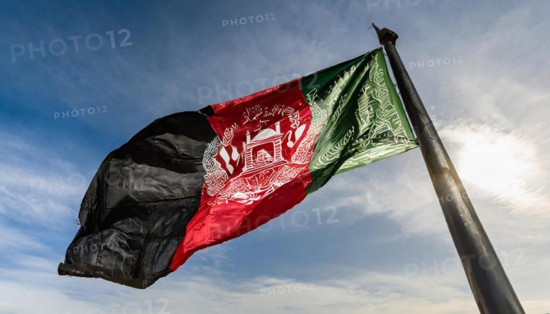 Flag, the national flag of Afghanistan flutters in the wind