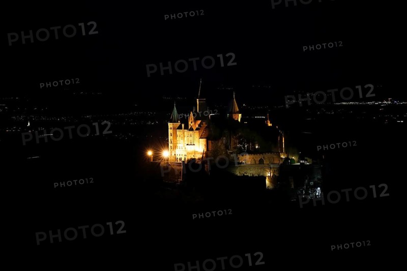 Hohenzollern Castle, ancestral castle of the princely family and former ruling Prussian royal and German imperial house of Hohenzollern, summit castle, historical building by the Berlin architect Friedrich August Stueler, architecture, neo-Gothic, castle building, aristocratic residence, south view from the Zellerhorn, night view, illumination, artificial light, Bisingen, Zollernalbkreis, Baden-Wuerttemberg, Germany, Europe