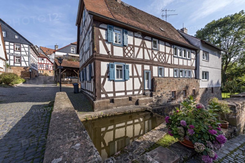 Former mill on the Muehlgraben, historic half-timbered house from around 1709, cultural monument, listed building, old town, Ortenberg, Vogelsberg, Wetterau, Hesse, Germany, Europe