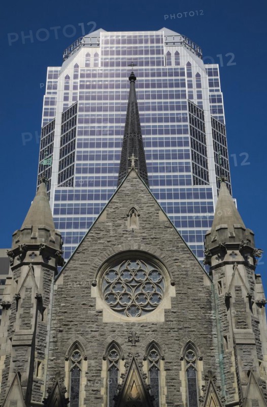 Old Christ Church Cathedral facade with rose window and modern architectural steel and blue tinted glass windows KPMG office tower in summer, Montreal, Quebec, Canada, North America