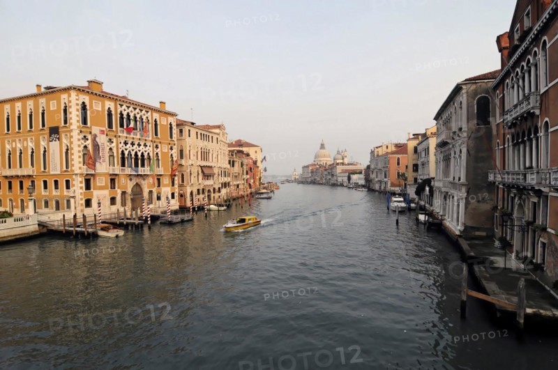 Canale Grande, in the background the church of Santa Maria della Saluti, view over a Venetian canal at dusk with boats and house fronts, Venice, Veneto, Italy, Europe