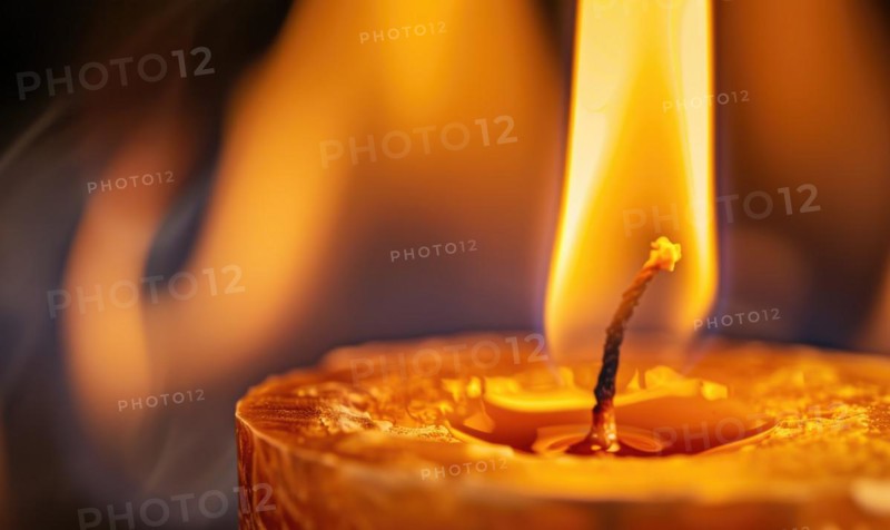Close-up of a candlewick engulfed in flames AI generated