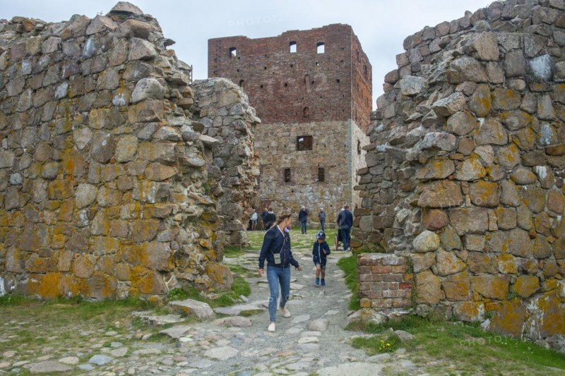 Tourists in Hammershus which was Scandinavia's largest medieval fortification and is one of the largest medieval fortifications in Northern Europe. Now ruin and located on the island Bornholm, Denmark, Baltic Sea, Scandinavia, Europe