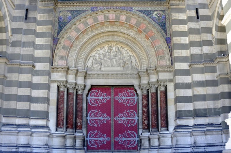 Marseille Cathedral or Cathedrale Sainte-Marie-Majeure de Marseille, 1852-1896, Marseille, Historic church door with Gothic architecture, surrounded by mosaics and ornamented columns, Marseille, Departement Bouches-du-Rhone, Region Provence-Alpes-Cote d'Azur, France, Europe