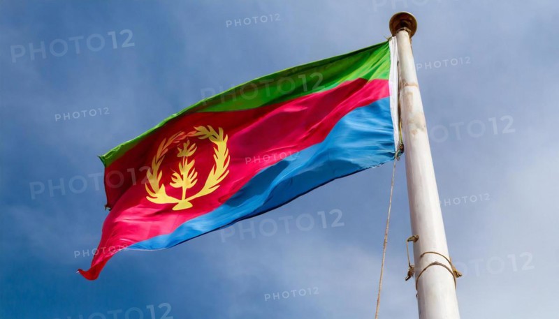 Flags, the national flag of Eritrea flutters in the wind