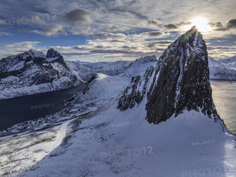 Aerial view of Bergen by the sea, fjord, sunbeams, winter, snow, Mount Segla, Senja, Troms, Norway, Europe