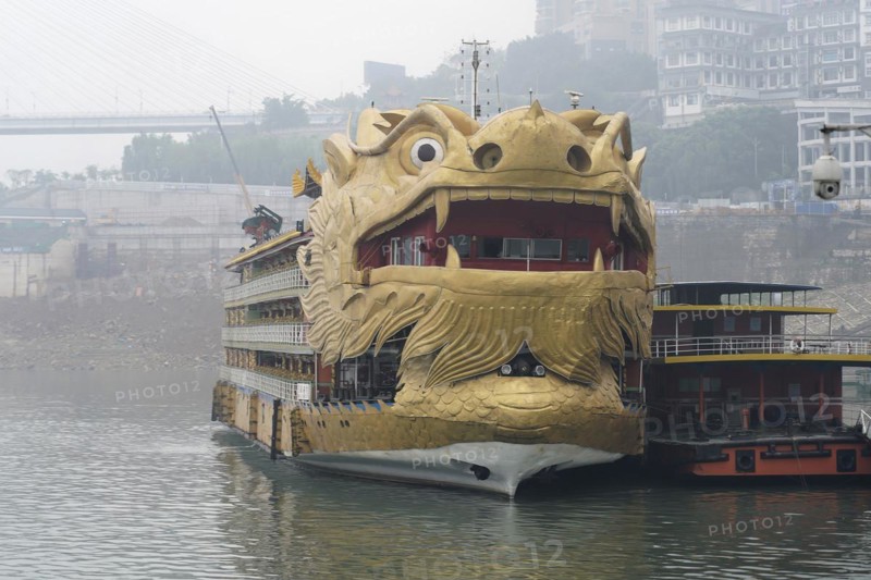 Yichang, Hubei Province, China, Asia, A ship in the shape of a golden dragon's head floats on a misty river, Asia