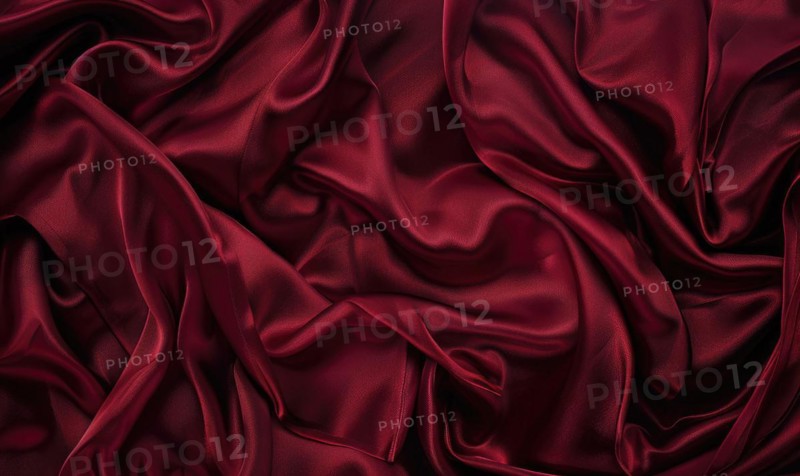 Background covered in opulent silk fabric in deep ruby red AI generated