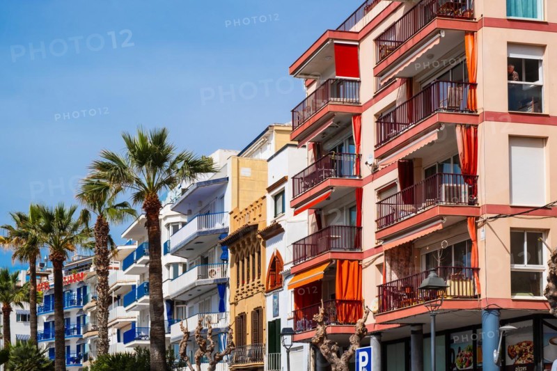 Row of houses on the beach promenade in Sitges, Spain, Europe