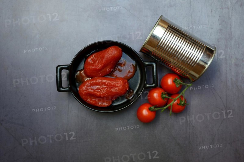 Whole tinned tomatoes in a pot, tomatoes and tins