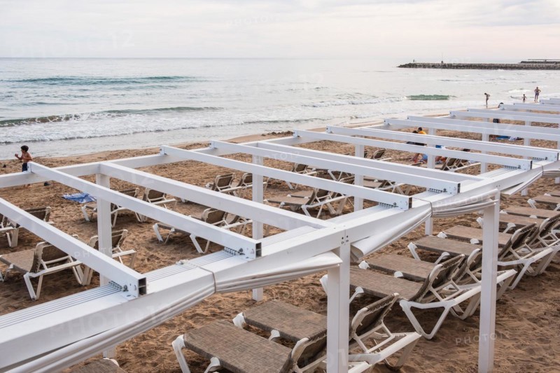 Empty sunbeds on the beach in Sitges, Spain, Europe