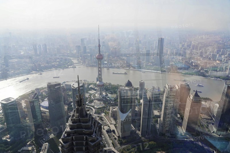 View from the 632 metre high Shanghai Tower, nicknamed The Twist, Shanghai, People's Republic of China, aerial view of a veiled city with skyscrapers and a river, Shanghai, China, Asia