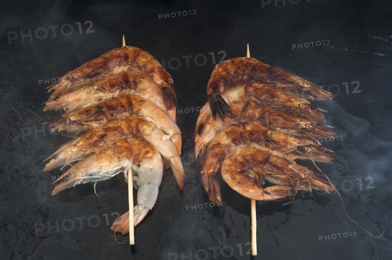 Spit-roasted prawns on a plancha, gas barbecue, Vandee, France, Europe