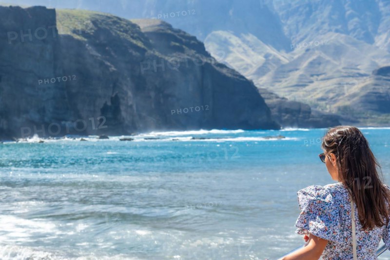 A woman on the beach of Puerto de Las Nieves in Agaete on Gran Canaria, Spain, Europe