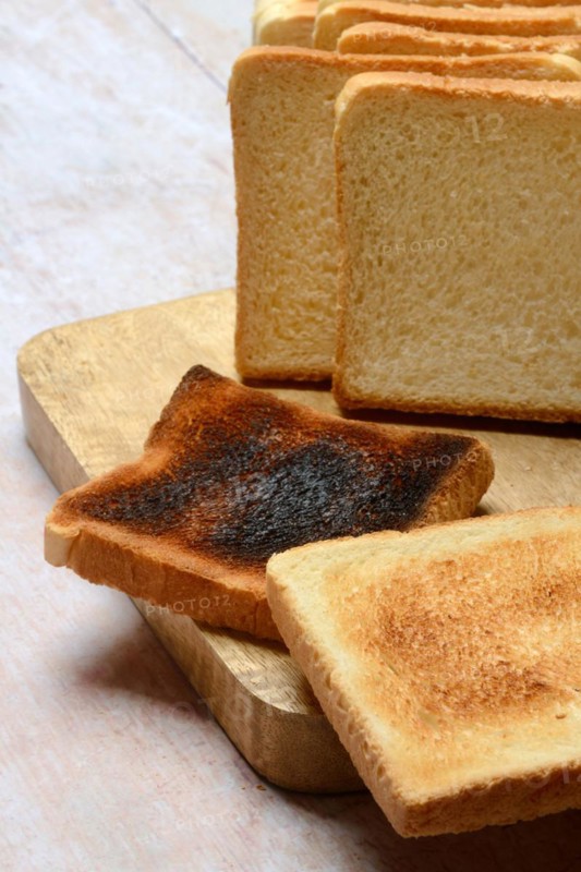 Burnt slice of toast with toast, toast