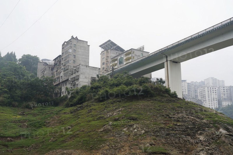 Cruise ship on the Yangtze River, Hubei Province, China, Asia, A city bridge crossing a river with surrounding mountains and skyscrapers, Yichang, Asia