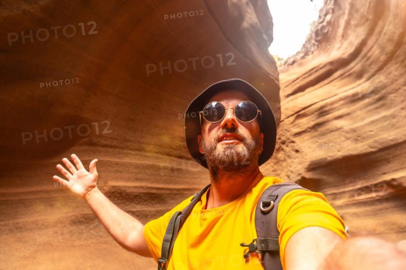 Selfie of a tourist enjoying in the limestone canyon Barranco de las Vacas in Gran Canaria, Canary Islands