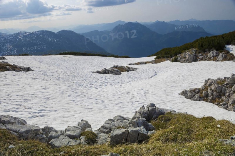 Amazing mountains panorama from 5 Fingers viewing platform in the shape of a hand with five fingers on Mount Krippenstein in the Dachstein Mountains of Upper Austria, Salzkammergut region, Austria, Europe