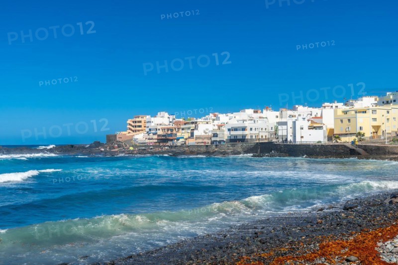 Beautiful beach in summer of Playa el Puertillo and its beautiful town in Gran Canaria. Spain