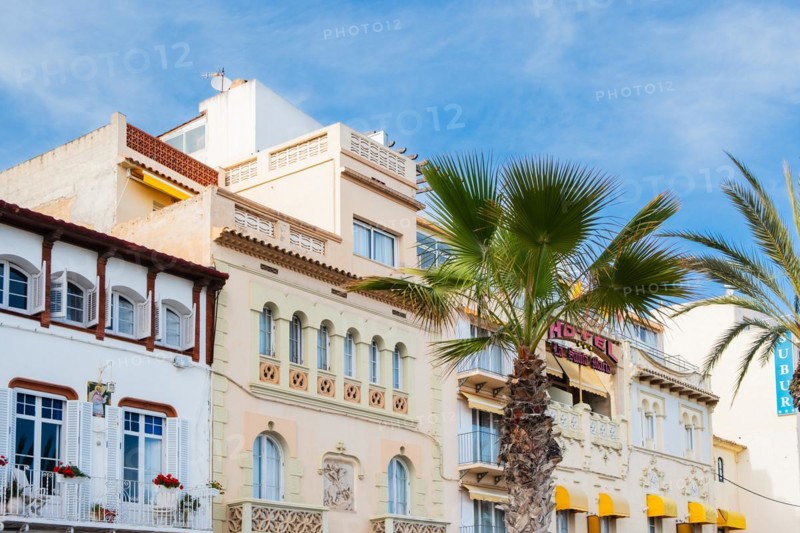 Row of houses on the beach promenade in Sitges, Spain, Europe