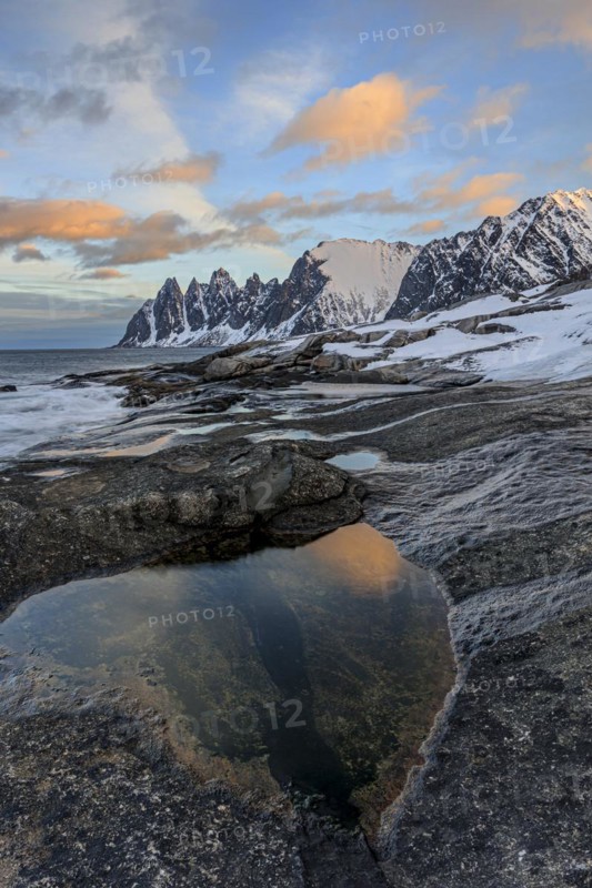 Rocky coast in front of Bergen, sea and pond, morning mood with clouds, winter, Tungeneset, Senja, Troms, Norway, Europe