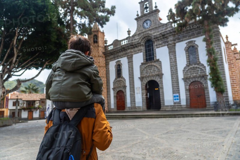 A mother with her son visiting the Basilica of Nuestra Senora del Pino in the municipality of Teror. Gran Canaria, Spain, Europe