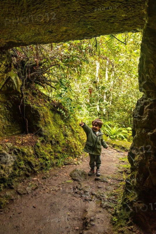 A boy in a cave in the Laurisilva forest of Los tilos de Moya, Gran Canaria