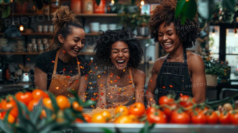 Friends in aprons laughing joyfully amid flying tomatoes while cooking a vegetarian receipt, AI generated