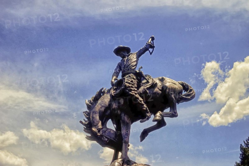 Cowboy on bucking horse, monument, Teton County, Jackson, Wyoming, USA, North America