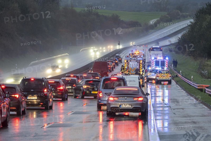 Traffic jam after an accident on the A5 motorway on a wet road, Nieder-Ohmen, Hesse, Germany, Europe