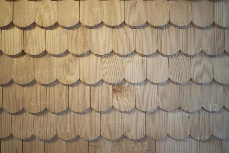 Wooden shingles are arranged like fish scales, surface, pattern and background