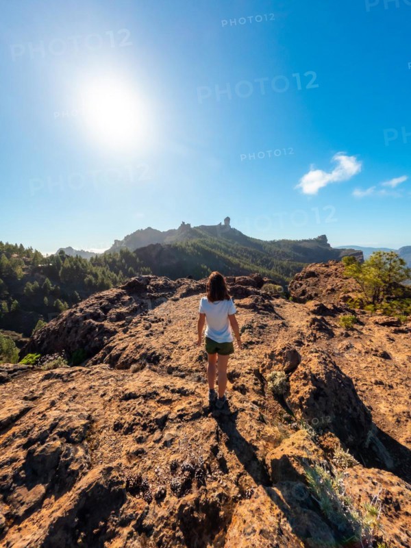 A woman hiker at a viewpoint of Roque Nublo in Gran Canaria, Canary Islands