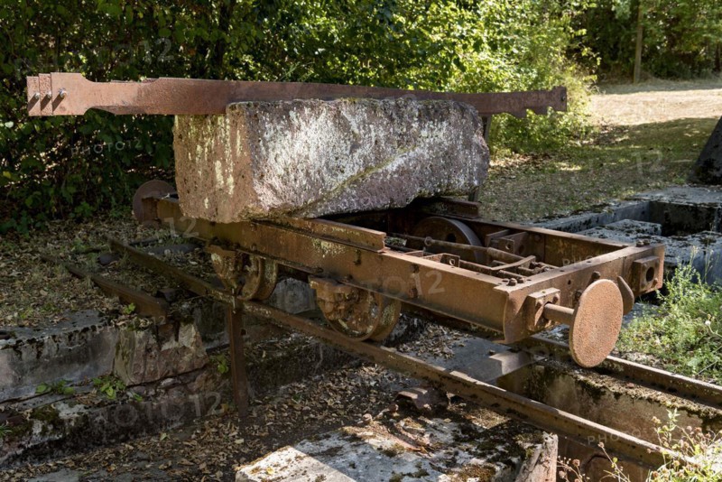 Rusty wagon, wagon on rail with block of Michelnau tuff, red basalt, red lava, slag agglomerate, disused Michelnau quarry, Tertiary volcano, geotope, industrial monument, Michelnau, Vogelsberg Volcanic Region nature park Park, Nidda, Wetterau, Hesse, Germany, Europe