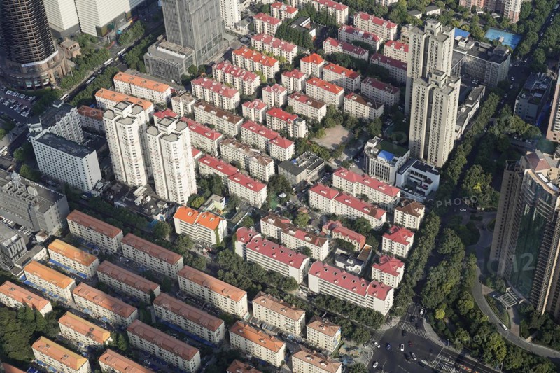 View from the 632-metre-high Shanghai Tower, nicknamed The Twist, Shanghai, People's Republic of China, aerial view of an urban residential area with colour-coordinated roofs, Shanghai, China, Asia