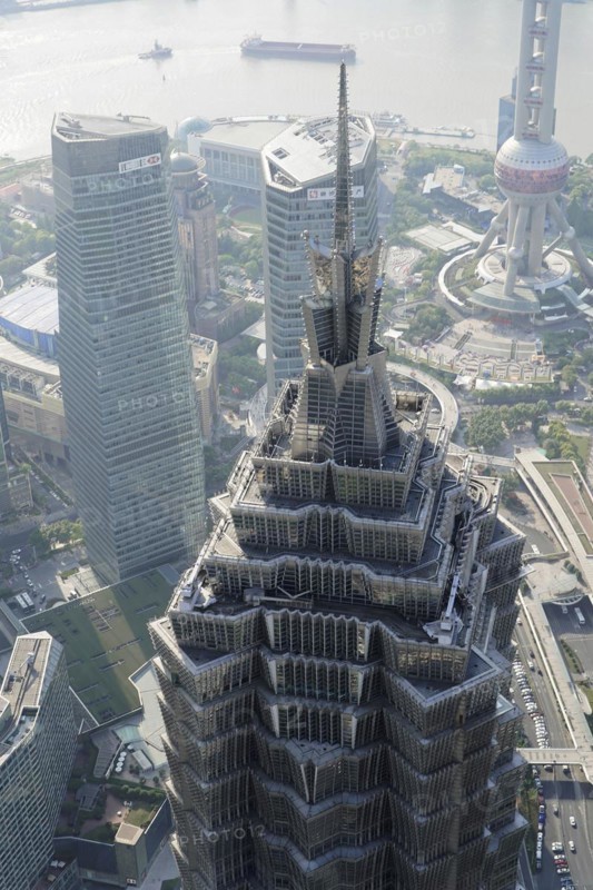 View from the 632 metre high Shanghai Tower, nicknamed The Twist, Shanghai, People's Republic of China, The facade of a skyscraper with the silhouette of a television tower in the background, Shanghai, China, Asia