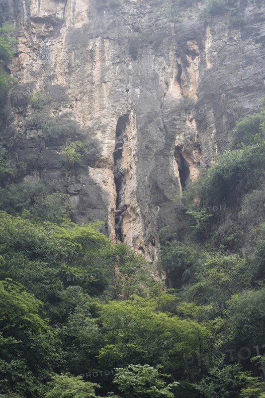 Cruise ship on the Yangtze River, Hubei Province, China, Asia, Rocky natural scenery with a large cave and surrounding green vegetation, Yichang, Asia