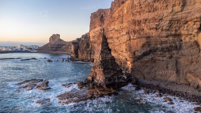 Aerial view of Agaete cliffs at summer sunset in Gran Canaria. Spain