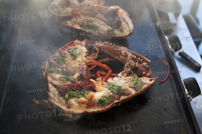 Cooked lobster (homarus) with caviar, vegetables and garlic butter on a plancha, Atlantic coast, Vandee, France, Europe