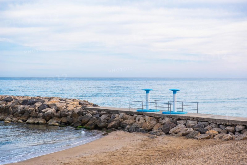 Showers on the beach in Sitges, Spain, Europe