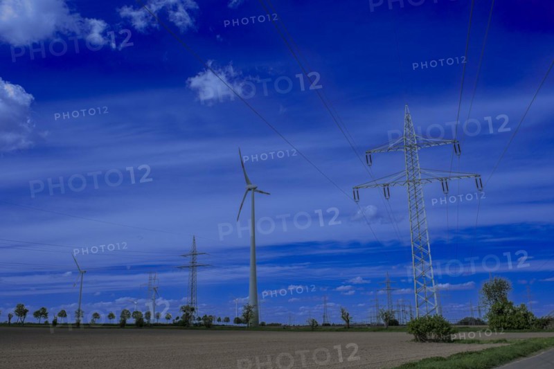 Power pylons with high-voltage lines on the K63 road with trees at the Avacon substation Helmstedt, Helmstedt, Lower Saxony, Germany, Europe