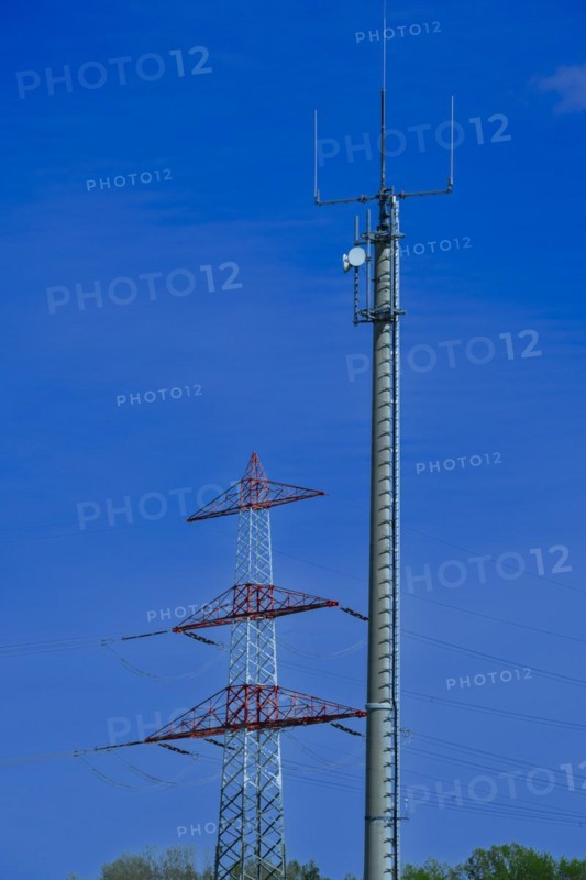 Electricity pylon with high-voltage lines and mobile phone mast near the Avacon substation Helmstedt, Helmstedt, Lower Saxony, Germany, Europe