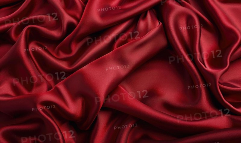 Background covered in opulent silk fabric in deep ruby red AI generated