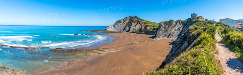 Panoramic of the Itzurun beach without people in the Flysch Basque Coast geopark in Zumaia, Gipuzkoa
