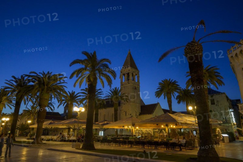 The blue hour over a scenery with palm trees and church tower, Trogir, Dalmatia, Croatia, Europe