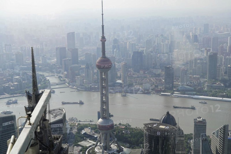 View from the 632 metre high Shanghai Tower, nicknamed The Twist, Shanghai, People's Republic of China, Urban view from above with skyscrapers rising out of a hazy atmosphere, Shanghai, China, Asia